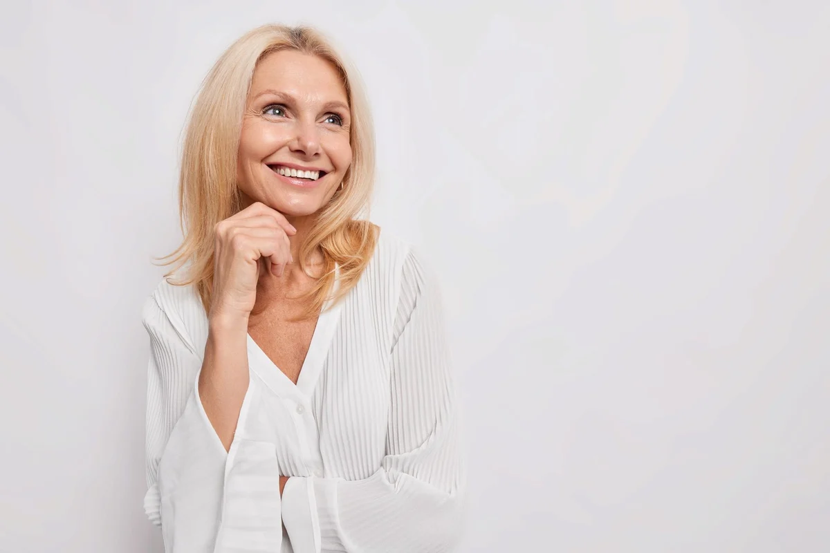 Smiling woman in a white blouse