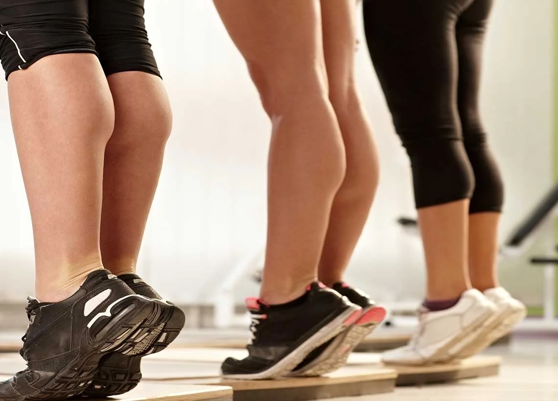 group performing calf raises to strengthen veins