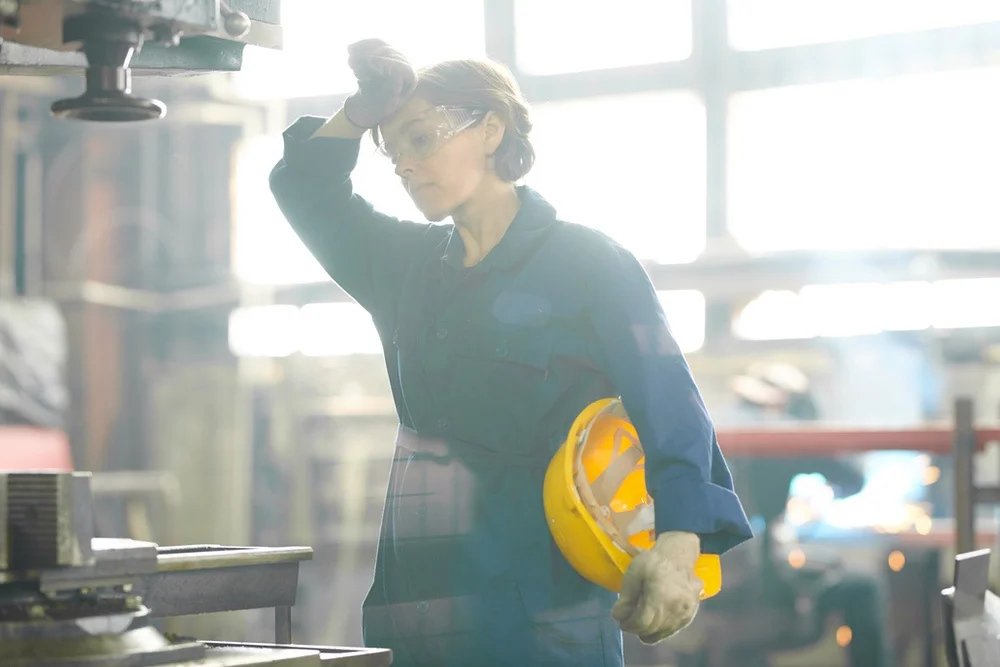 tired woman standing at work